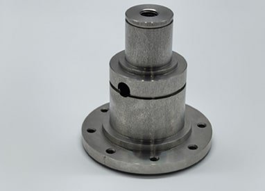 CNC-turned metal part with precision features for automotive applications.