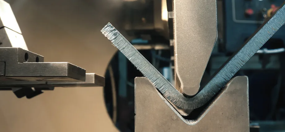 Sheet metal V-bending close up in a bending press machine