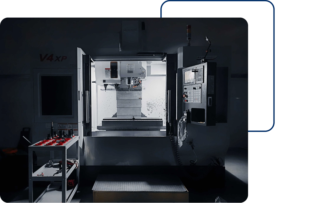 A CNC machining center set up in an industrial workshop.