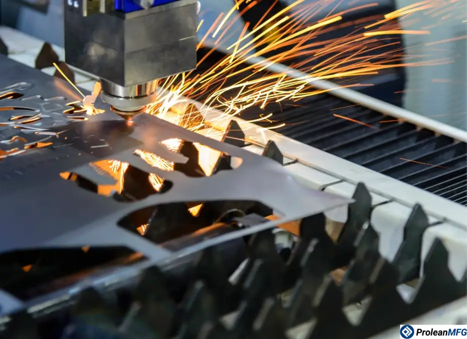 Close-up of sheet metal undergoing CNC cutting with bright sparks underneath and intricate cut patterns forming