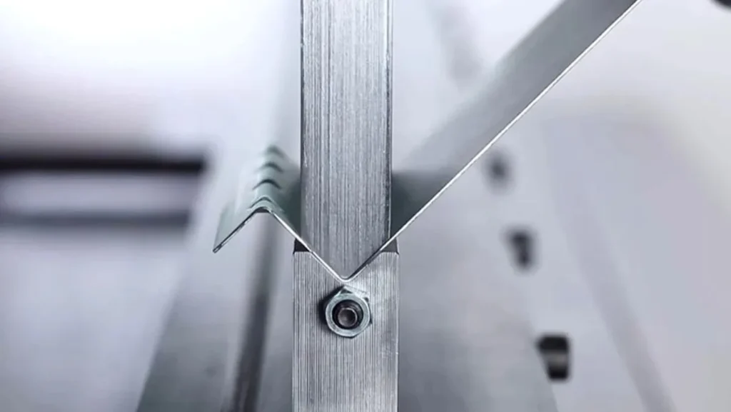 Close-up of a metal sheet being coined.