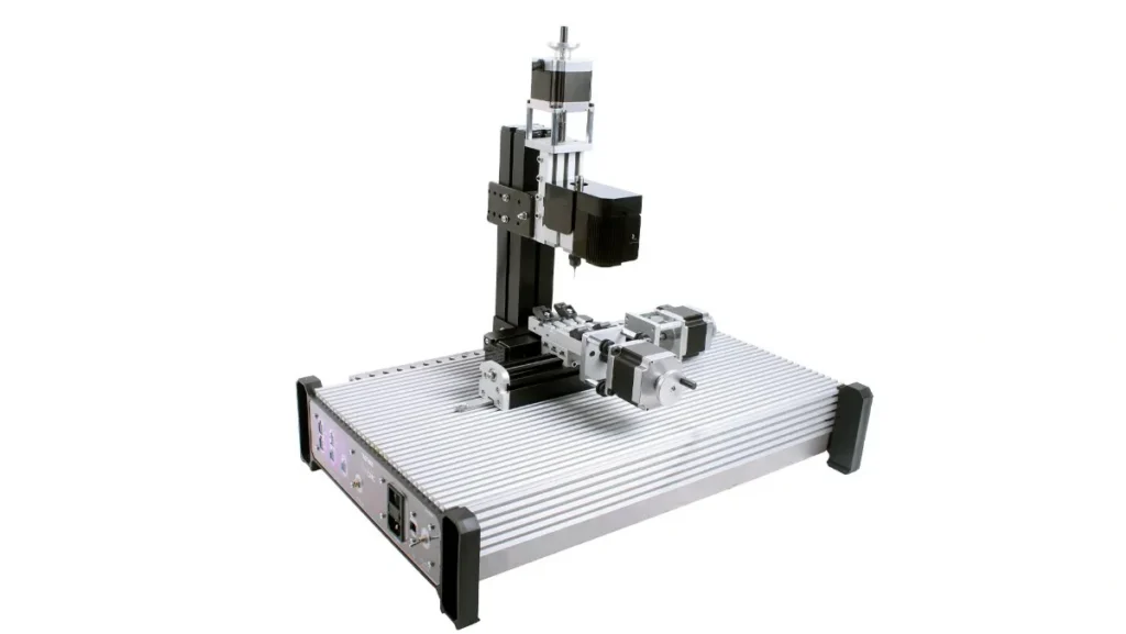Small 3-axis CNC machine on white background.