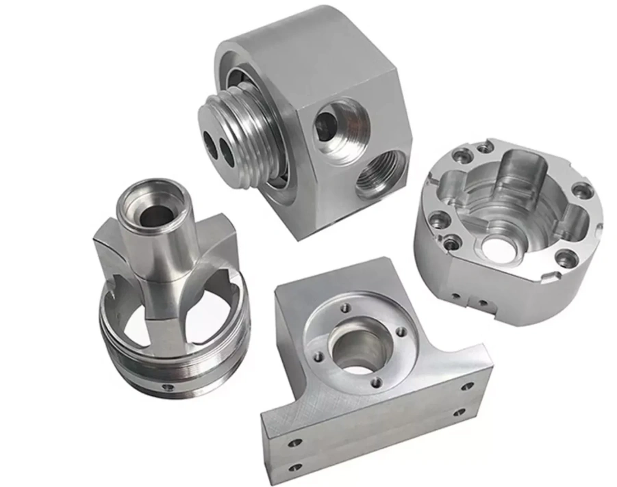 Set of four complex CNC machined parts with internal and external threads, mounting and recessed holes