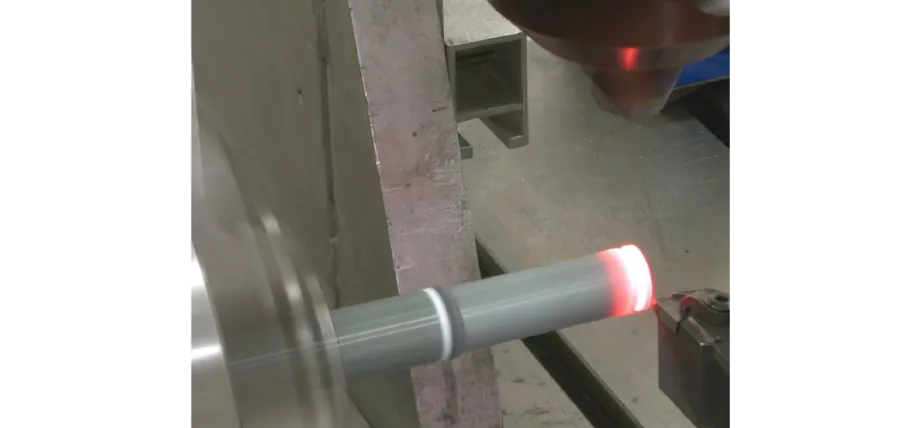 Laser heating the tip of a metal rod with a CNC lathe cutter for cutting metal rod for laser assisted machining
