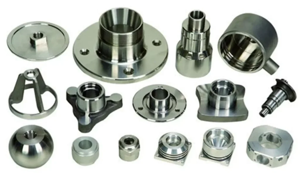 Various small silver CNC machined parts with central and mounting holes, arranged on white background, suited for military applications