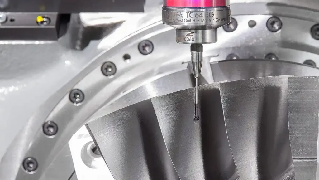 Measuring probe on a complex machined metal surface.