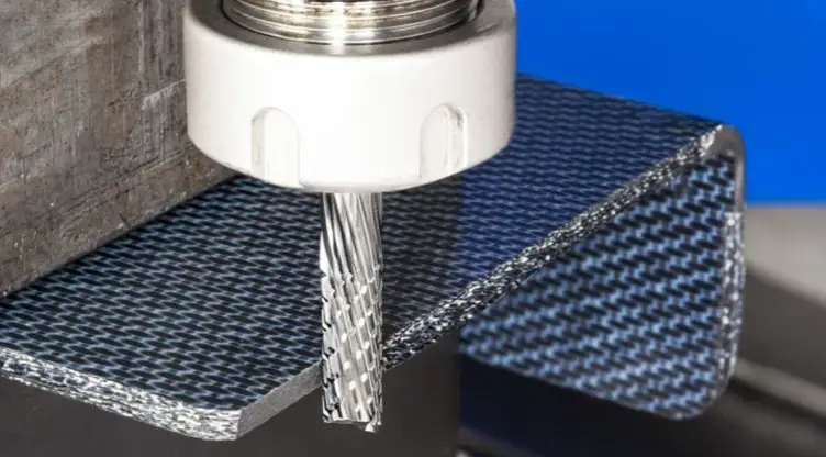 Composite material with black and white patterns being side milled.