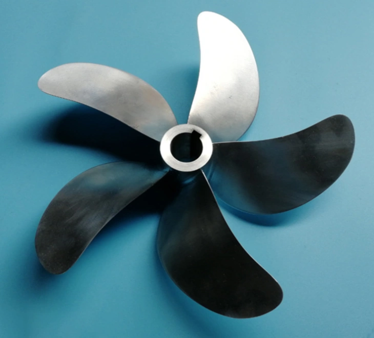A gray propeller with five wings and mounting hole with a keyway, blue background