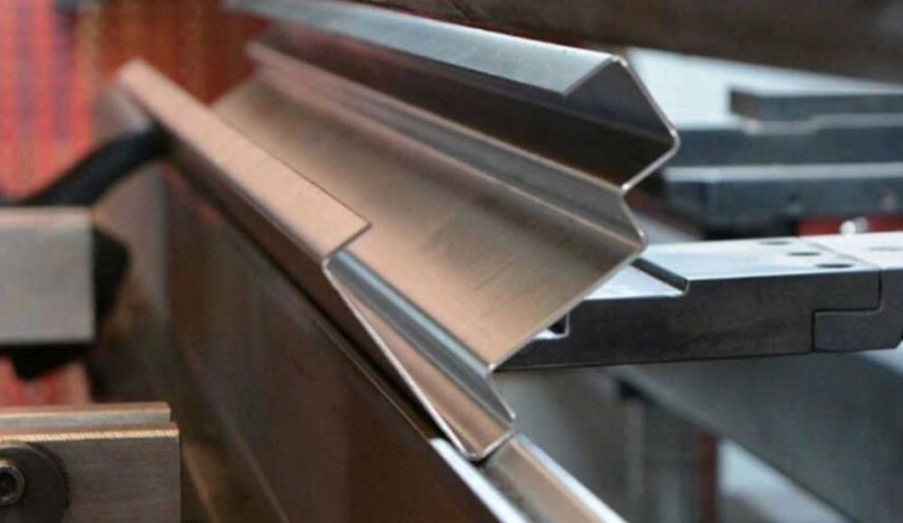 Close-up of Steel sheet metal formed into a complex angled profile through bending