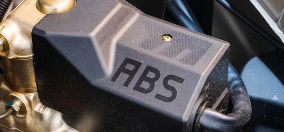 Plastic cover for car electronic box with text “ABS” 