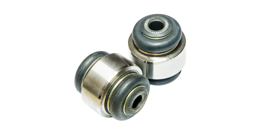 Car suspension bushings pair on a white background