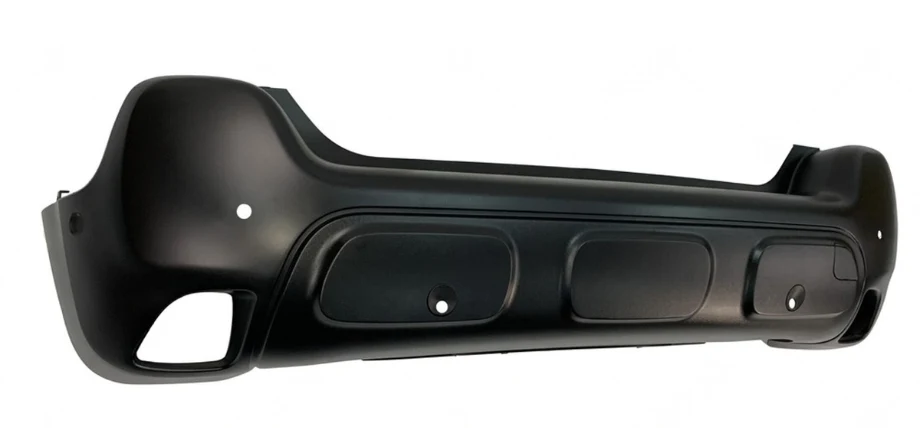 black injection molded car bumper on a white background