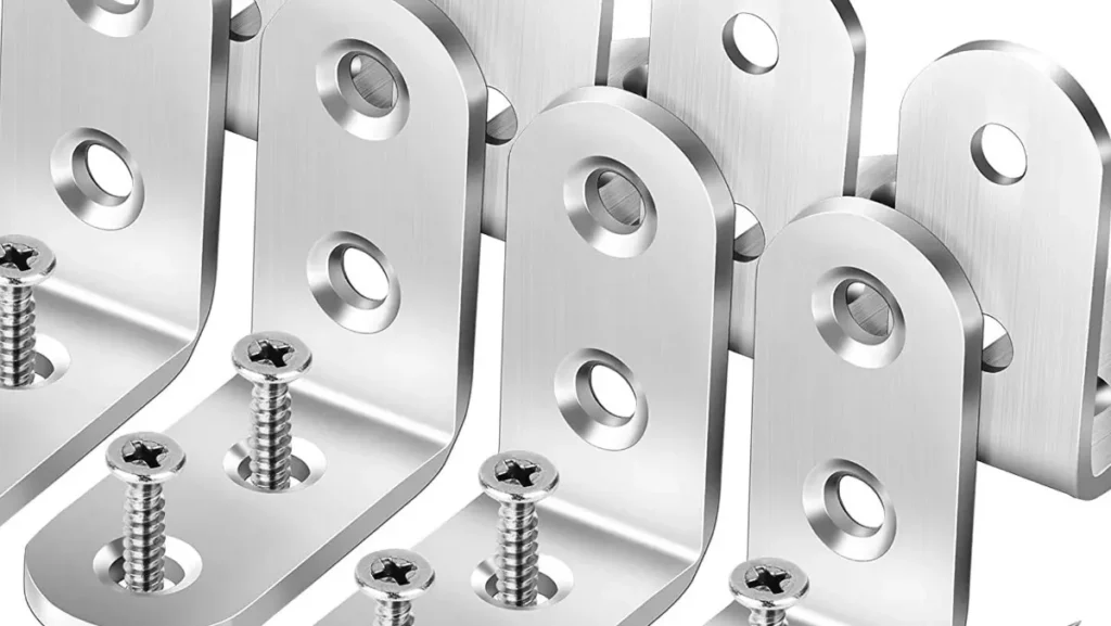 Close-up of shiny L-shaped brackets with screws.
