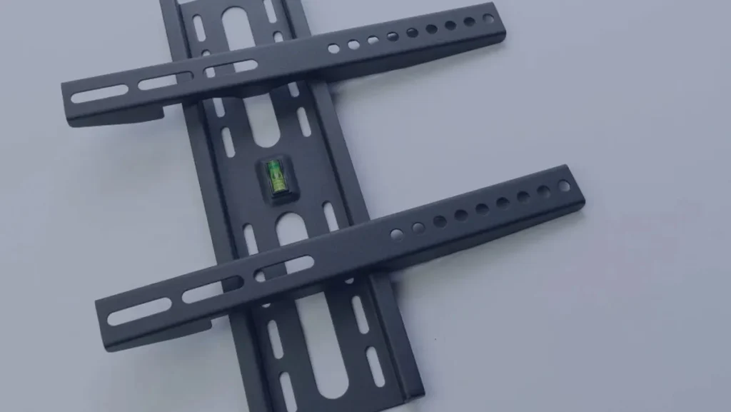 Black wall mount bracket with built-in level.