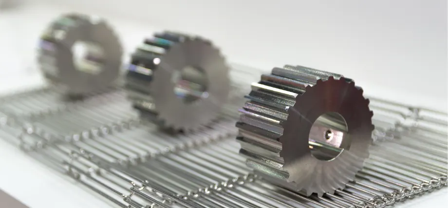 3 titanium gears shining with a hole in the center