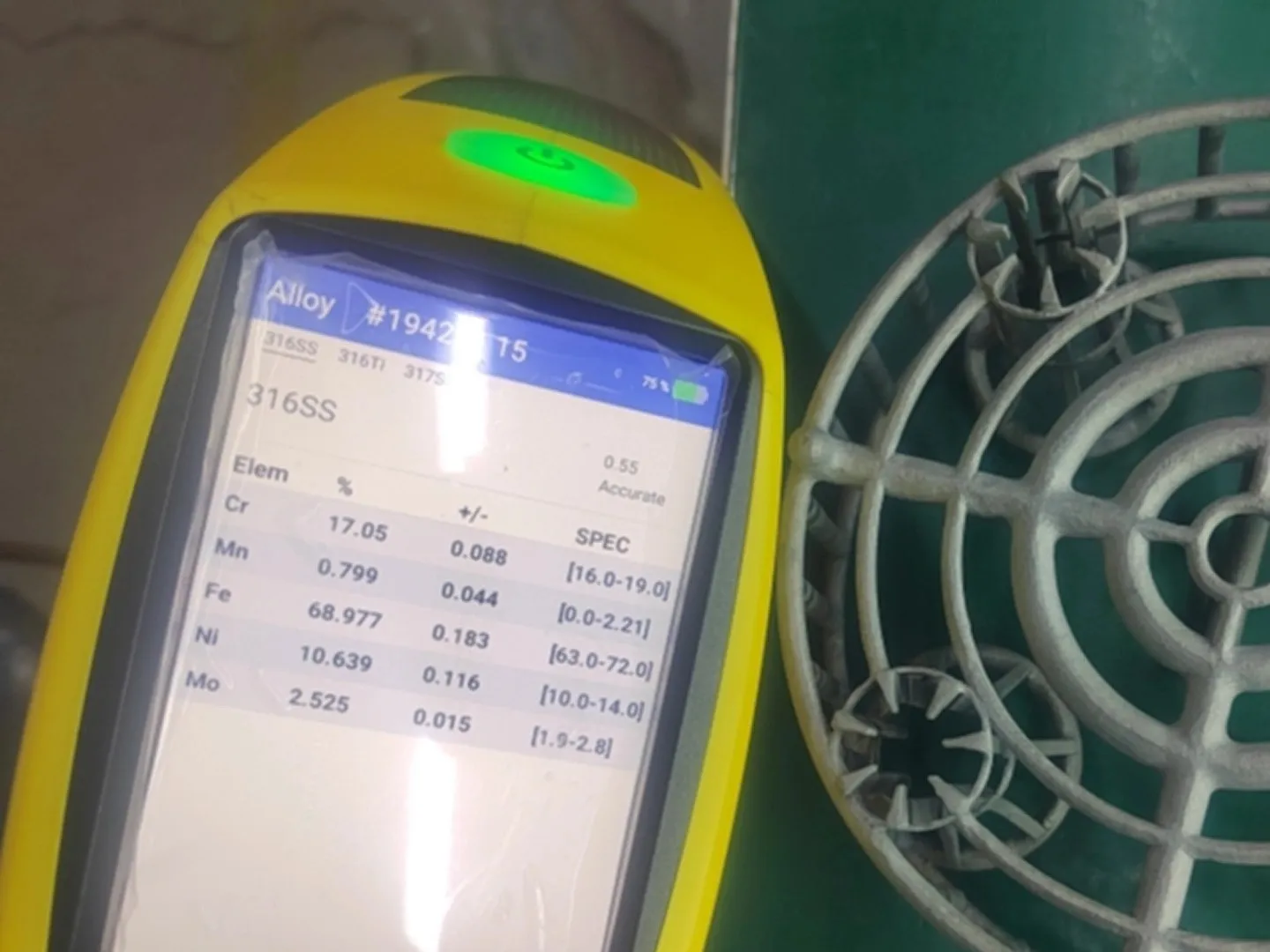 Spectrometer analysis result showing chemical composition of 316 stainless steel, including chromium, nickel, molybdenum, and iron content for material verification.