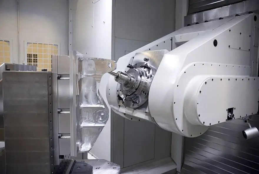 5-axis CNC machine performing complex aerospace milling on large structural component 