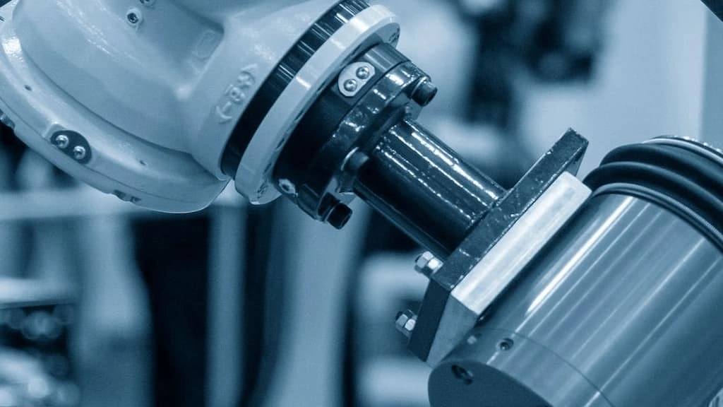 A close-up view of grinding the external surface of a cylindrical part