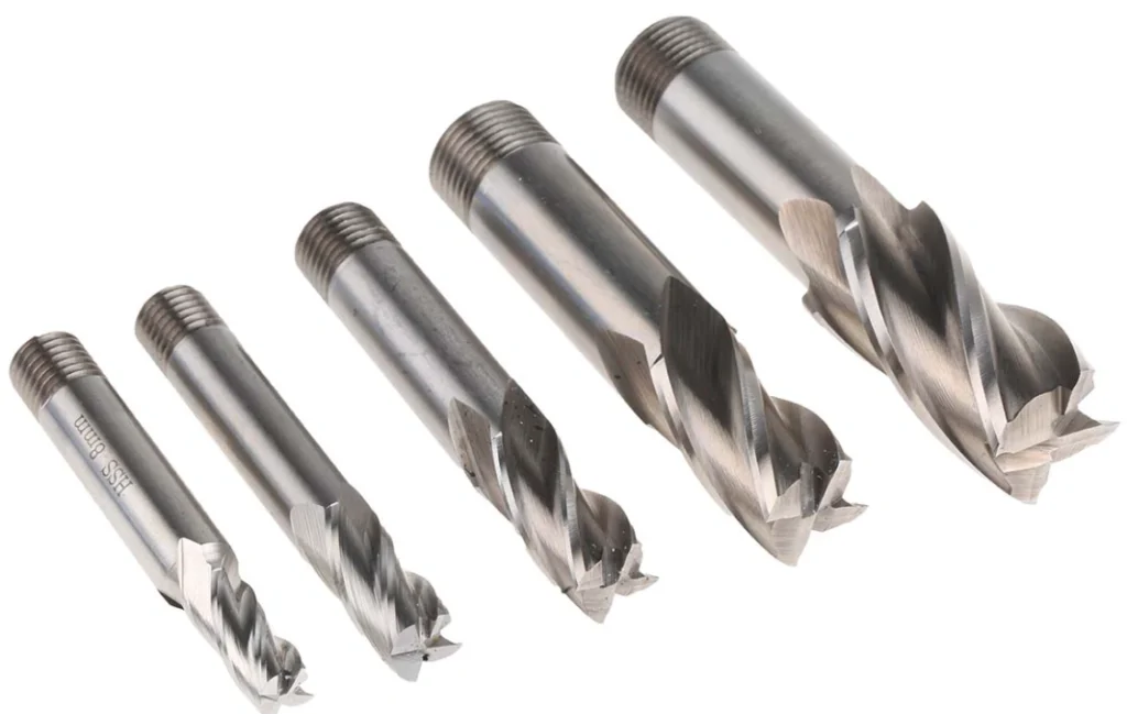 Set of five uncoated HSS end milling bits in graduated sizes arranged side by side.
