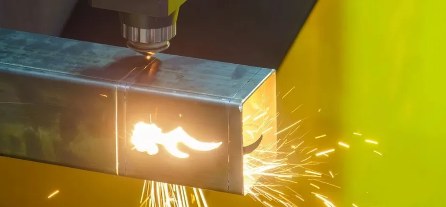 laser cutting head actively processing a square steel tube