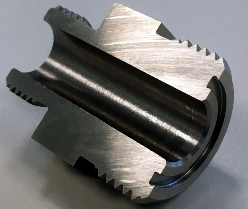 Machined cylindrical part with O-ring groove undercut and serrated external features