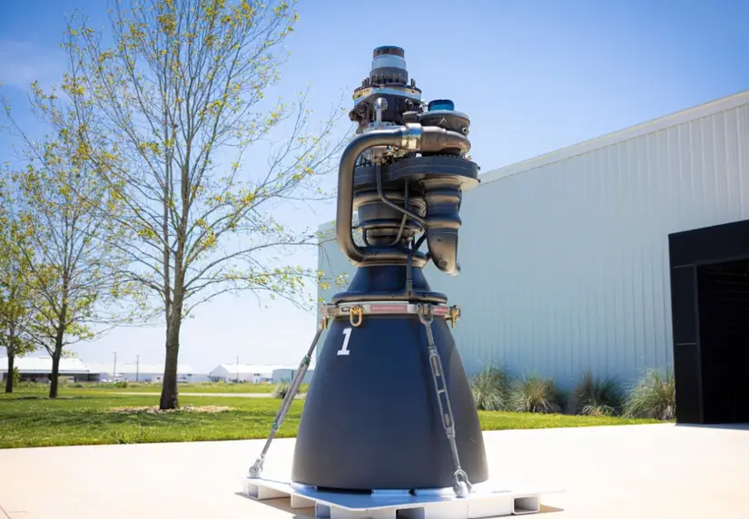 SpaceX Merlin rocket engine with CNC machined components displayed outdoors on a pallet