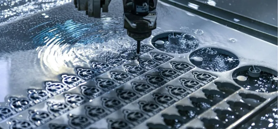 CNC milling machine with coolant flooding the workpiece, precision-machining a sheet of metal