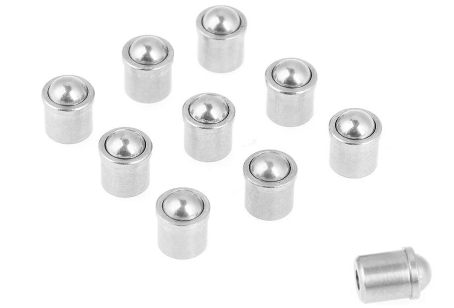 Ten metallic components with spherical undercuts trapping balls in place