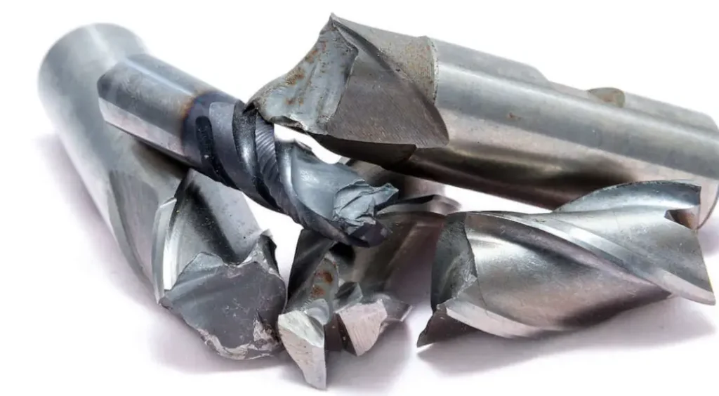 Broken and damaged undercutting end mills showing tool failure from undercut machining