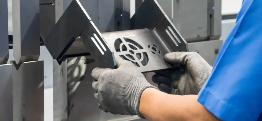 complex perforated and bent sheet metal component after stamping