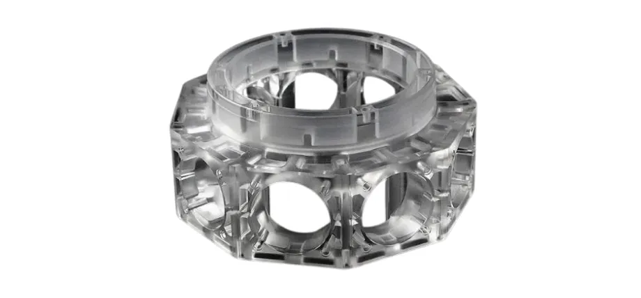 A high-precision CNC machined acrylic part featuring an intricate octagonal frame with circular side cutouts and internal ribbing.