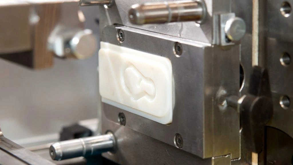 A rapid mold tooling, showing a half of a soft aluminum mold