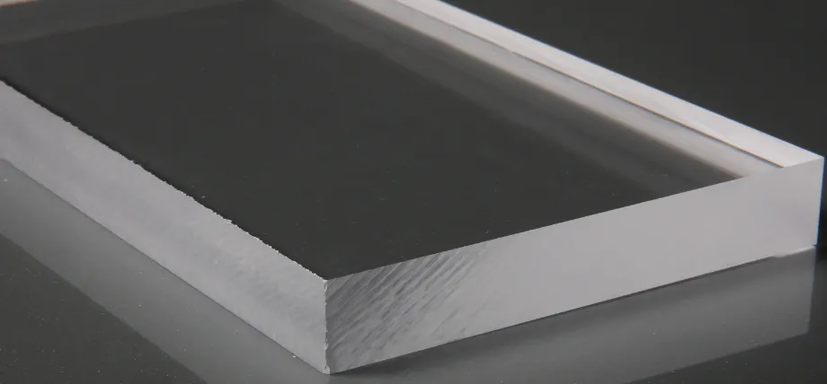 Close-up of a thick acrylic block showing the contrast between the polished top surface and the frosted
