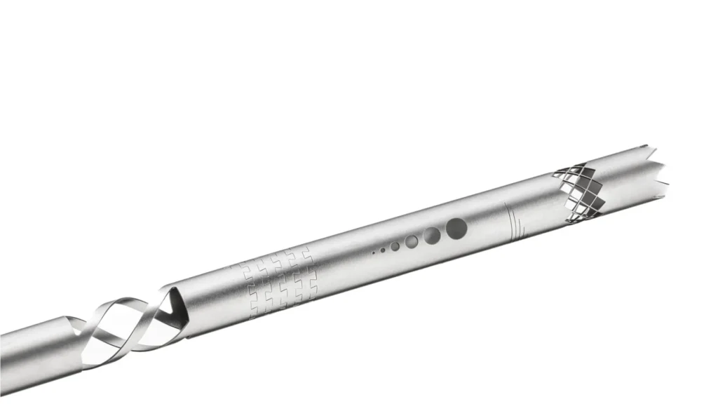 The image shows laser tube cutting of metal tubes used for medical device components.
