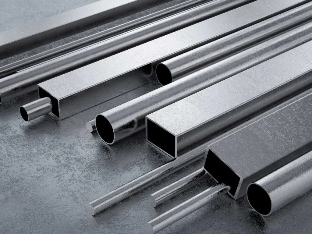 The image shows alloy steel stock in the form of bars, rods, and pipes.