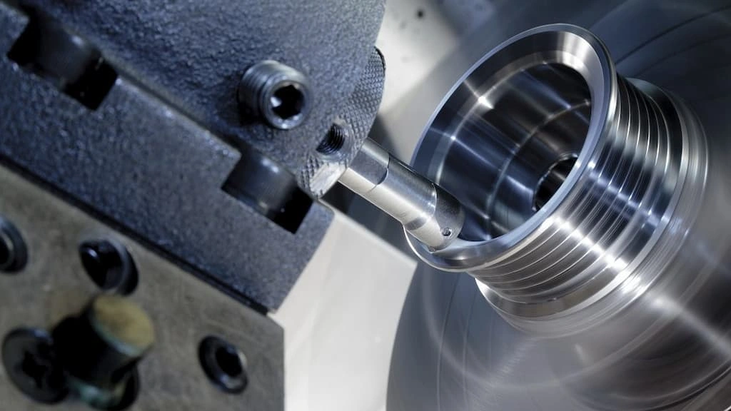 A close-up view of boring stainless steel in a lathe machine