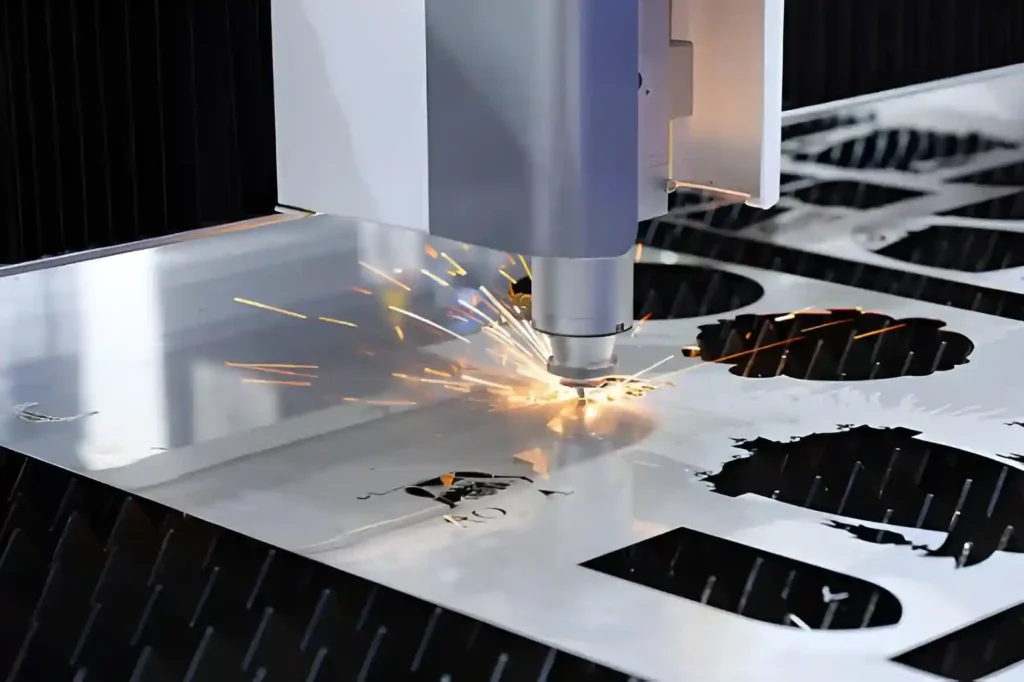 The image shows a fiber laser cutting machine processing a stainless steel sheet. Sparks are visible during cutting as the laser produces precise edges and profiles.