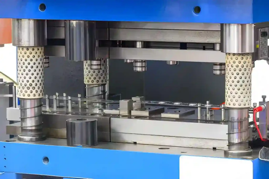 The image shows sheet metal stamping dies used in metalworking processes. These dies are used to form, cut, or shape metal sheets into specific parts during production.