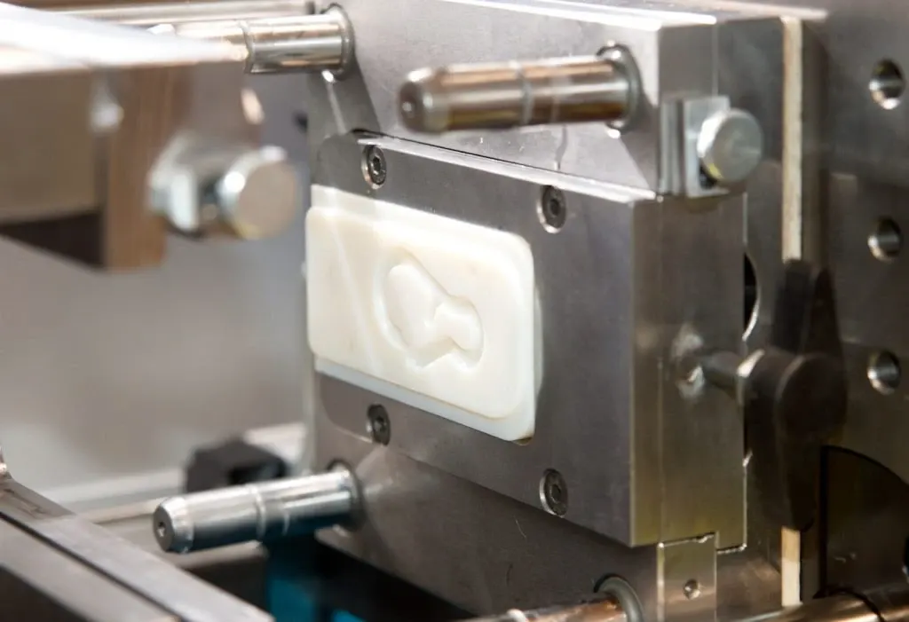 The image shows soft tooling used in manufacturing for prototype or low-volume production of parts.
