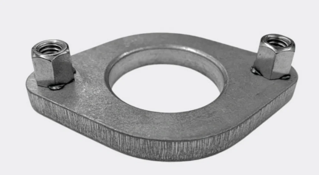 Custom-cut stainless steel exhaust flange with central circular opening and two welded hex nuts on a white background