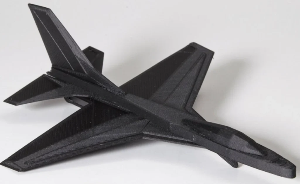 3D-printed carbon fiber-reinforced aircraft prototype with visible layer lines 