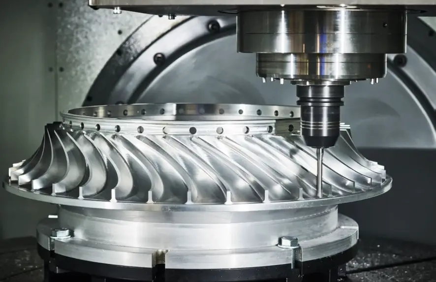 Aluminum CNC milling machine cutting a precision aluminum turbine impeller with curved blades