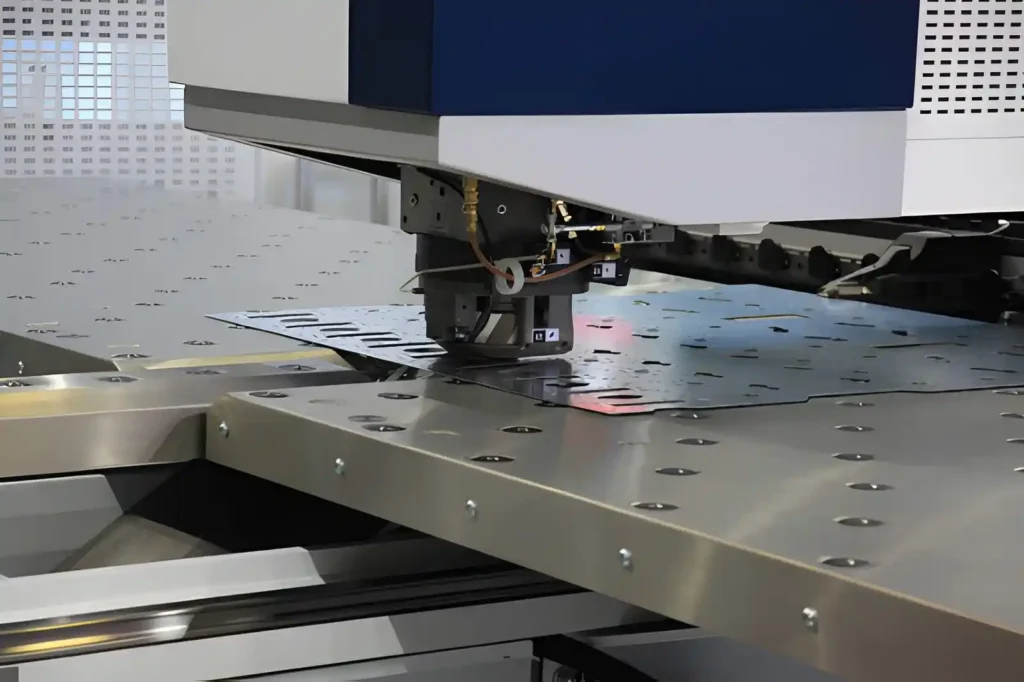 CNC punching machine in operation, cutting sheet metal