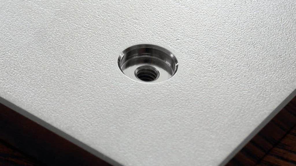 A close-up view of the counterbore hole on a metal sheet