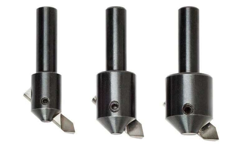 An illustration of tree fly cutter tools with round bits