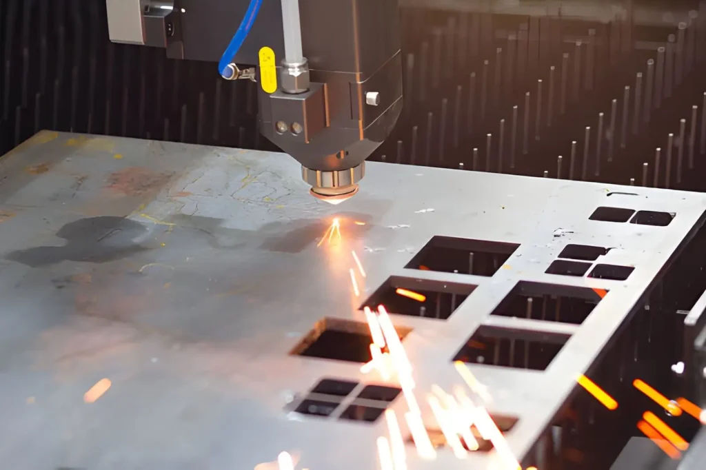 CNC laser cutting metal, producing sparks during the machining process
