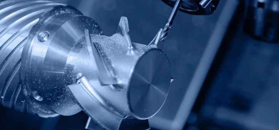 Precision CNC milling operation on a 4-axis setup, with a cutting tool machining intricate features on a rotating cylindrical aluminum workpiece