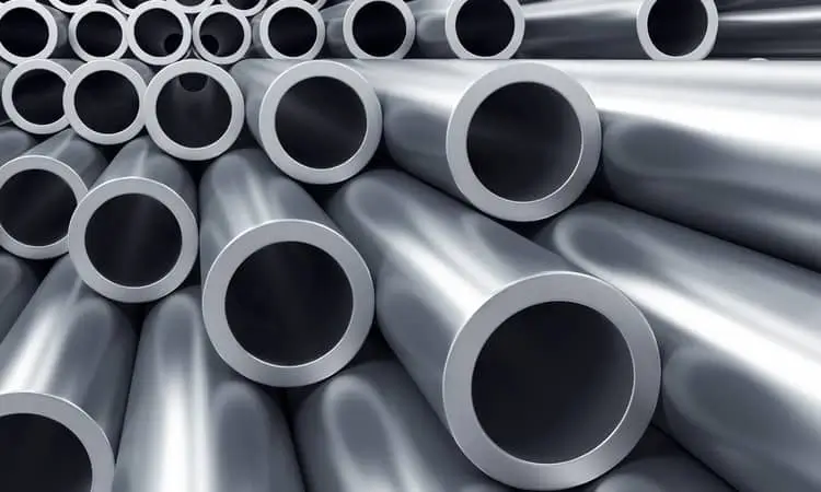 Stacked alloy steel pipes with smooth metallic surfaces and hollow circular cross-sections