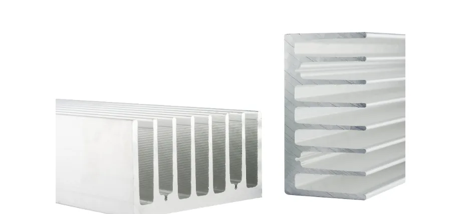 Two silver aluminum extruded heat sinks with a finned design used for thermal management in electronics