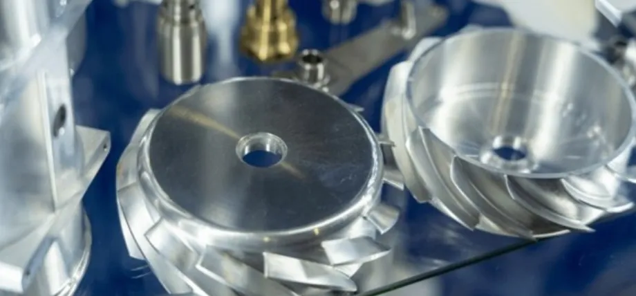 Precision-machined aluminum turbine or gear housing components with visible metallic fins